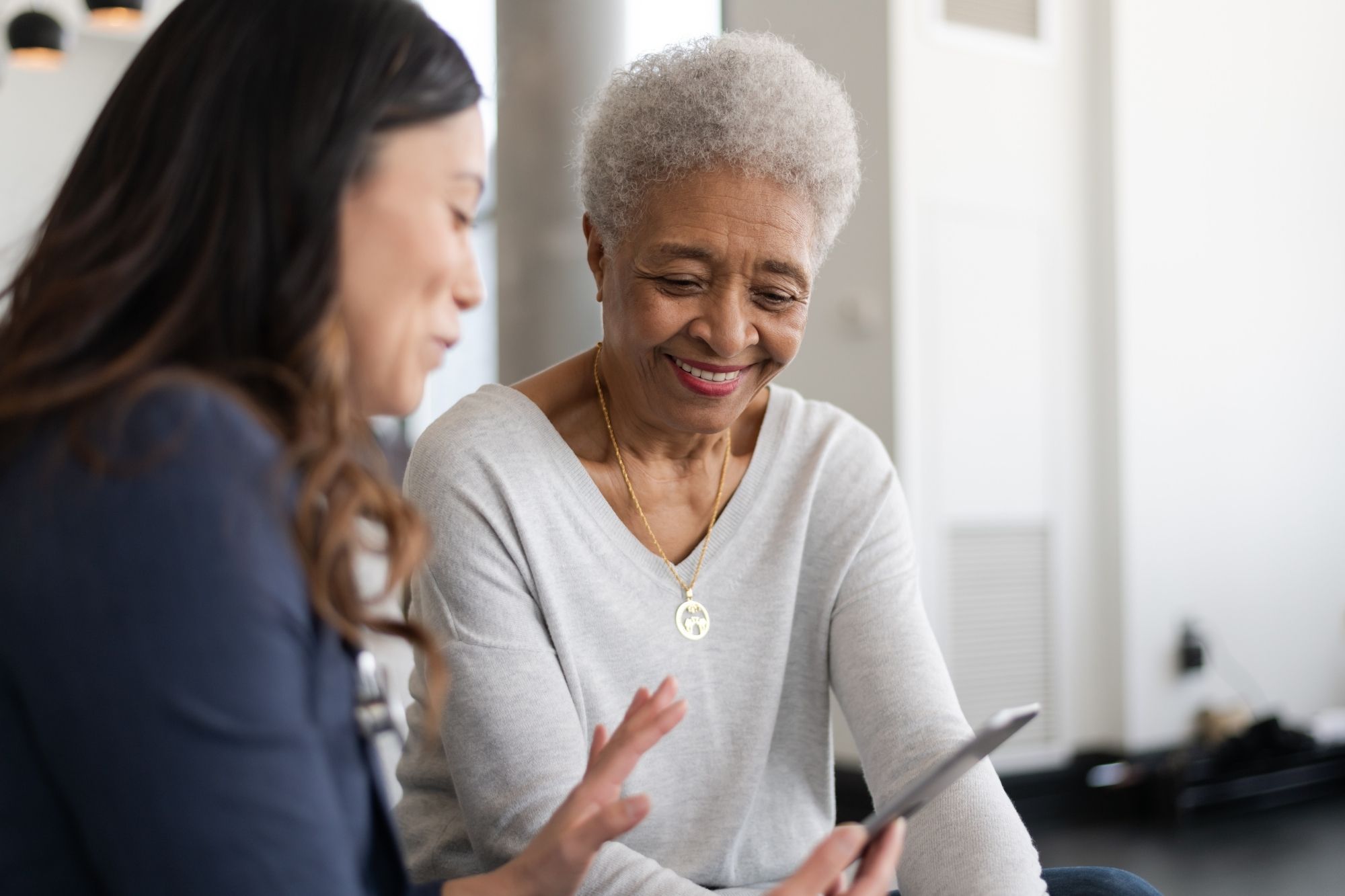 Companionship Services in Toronto, senior care services in Toronto, Caregiver assisting senior with in-home care services in Toronto